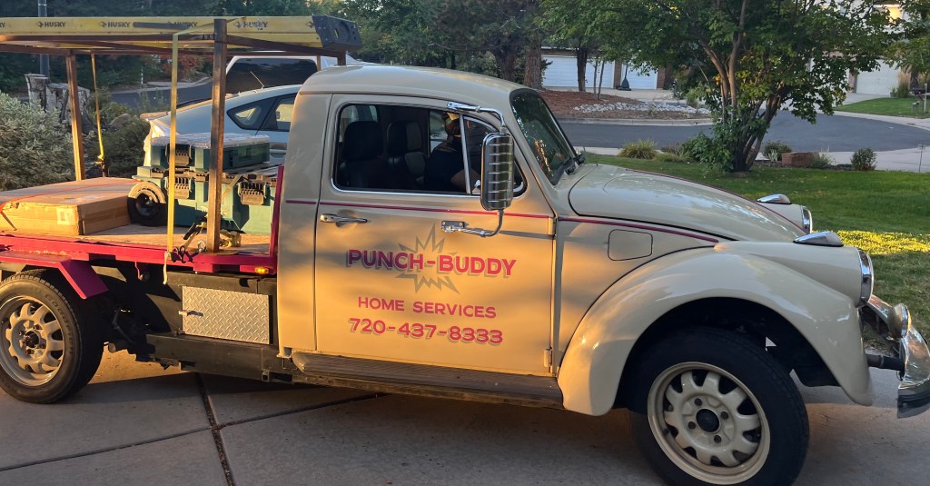 Punch-Buddy branded service truck parked in a Boulder neighborhood, loaded with tools and materials, representing a local, owner-operated home services team.